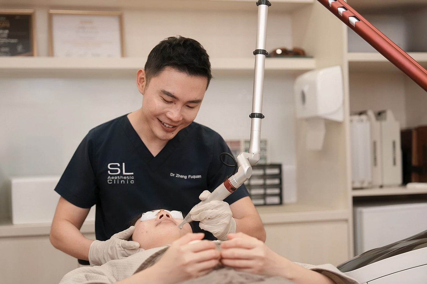 SL Aesthetic Clinic doctor performing Pico laser treatment on a patient's chin