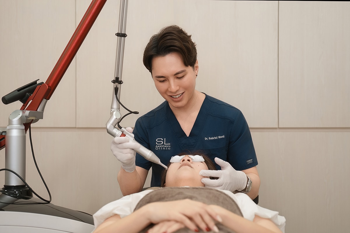 A Doctor doing Brightening Laser Treatment in a client